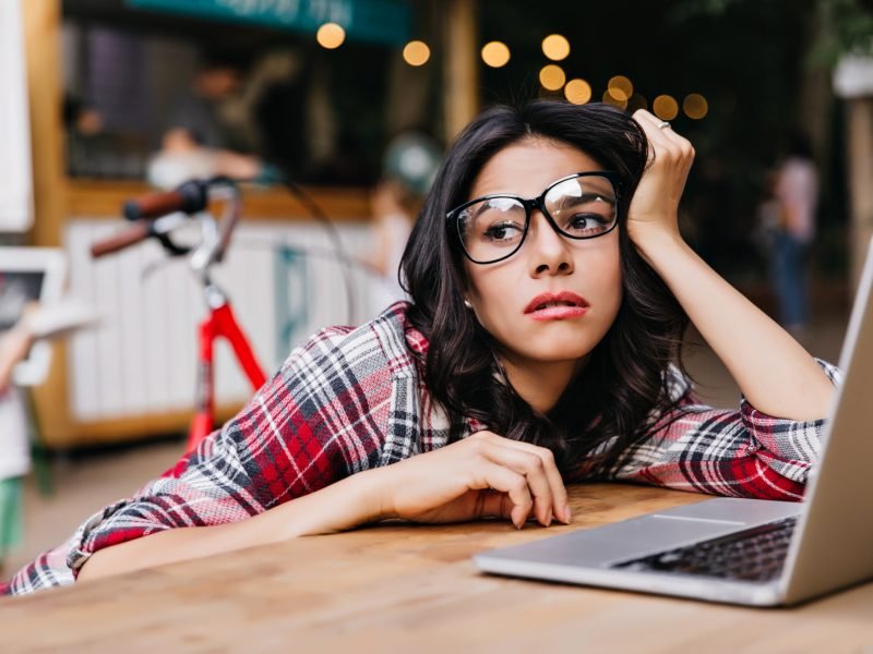 A woman feeling tired at a desk